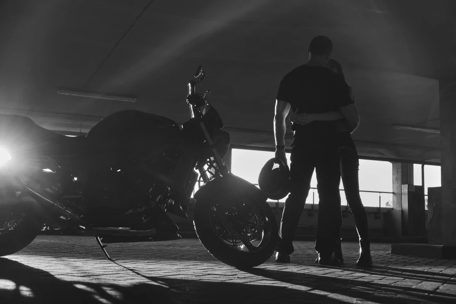 motorcycle and a sexy man hugging his woman